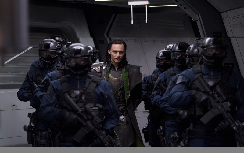 Loki surrounded by soldiers