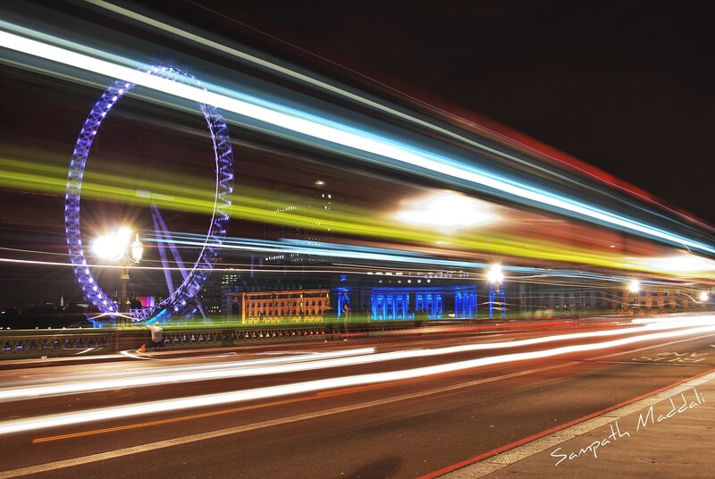 London Eye at night with light trails
