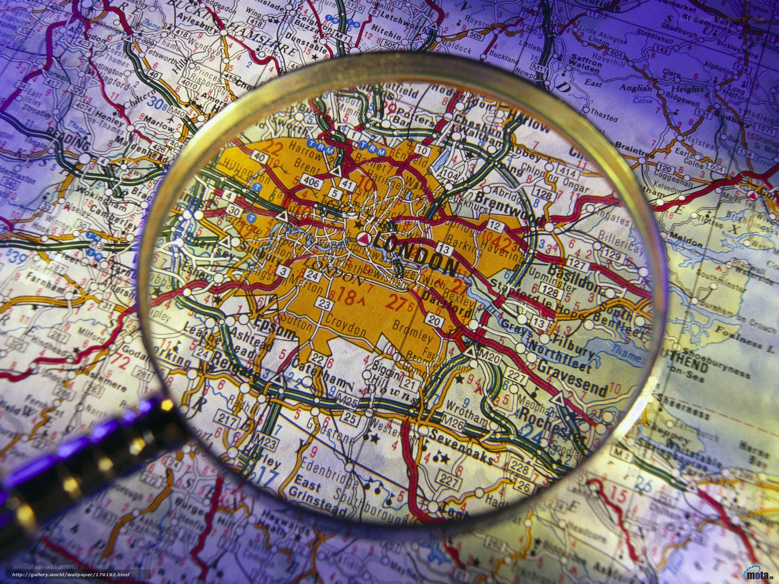 London map under magnifying glass