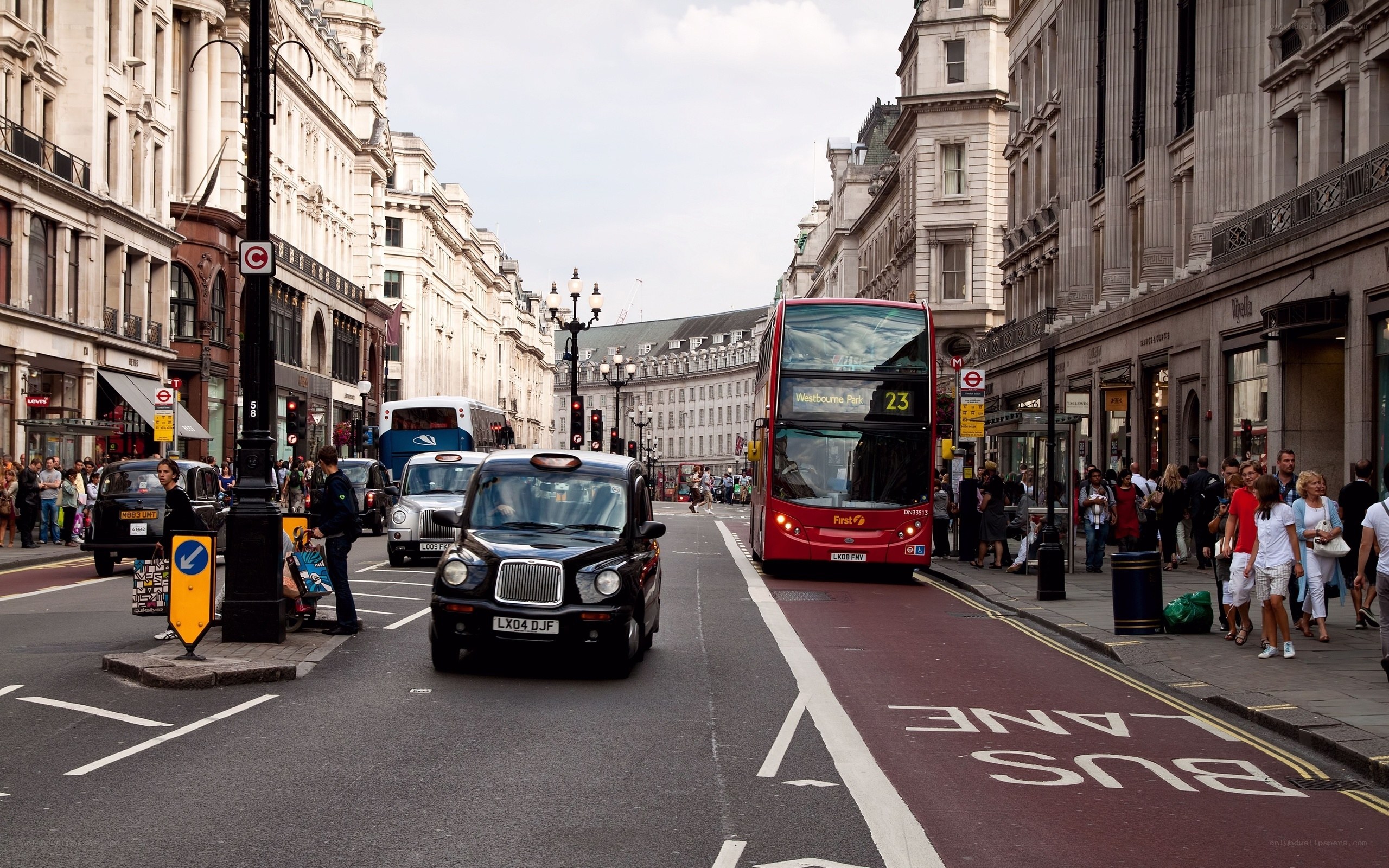 London street scene with buses and taxis