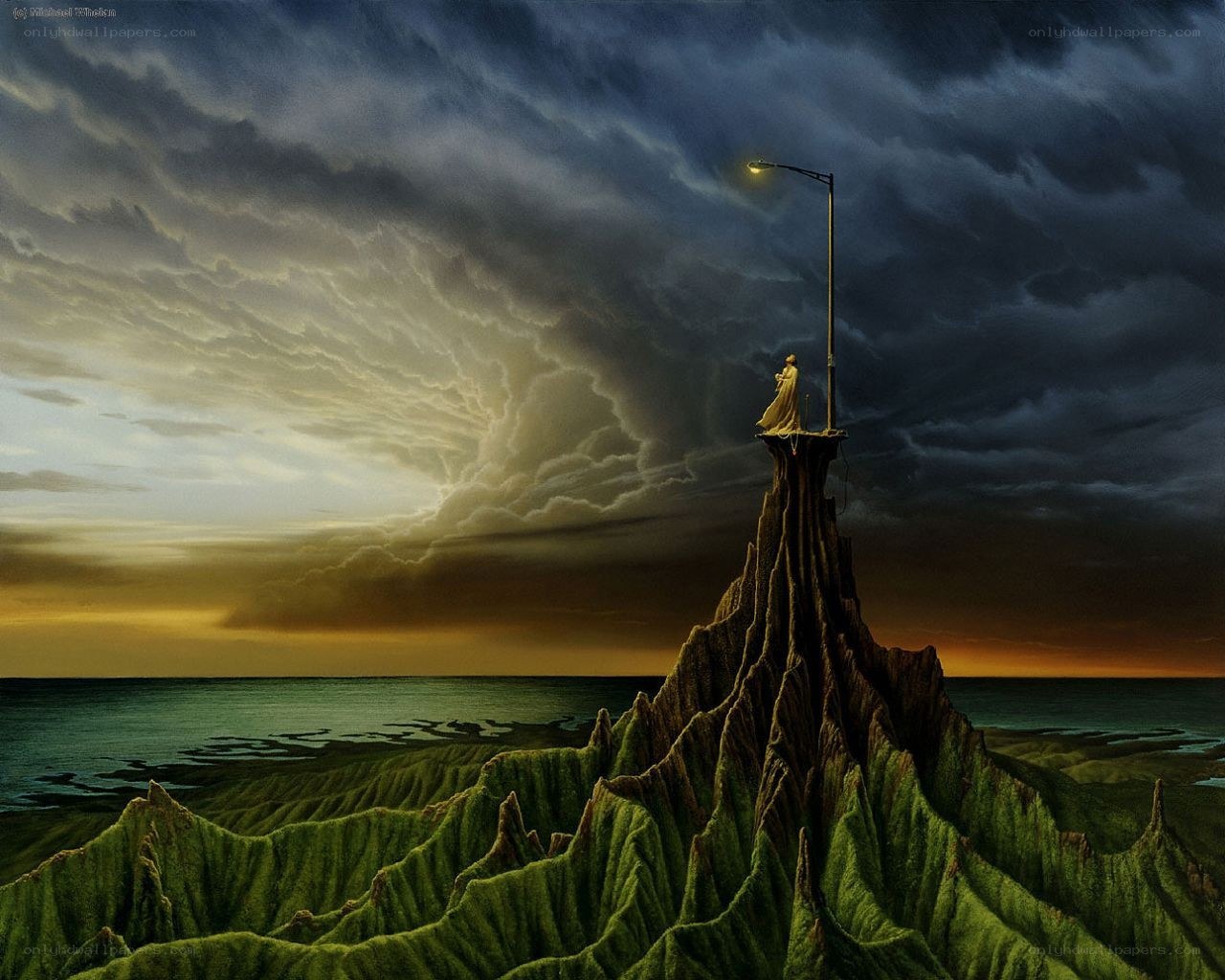 Lone figure on a cliff at dusk