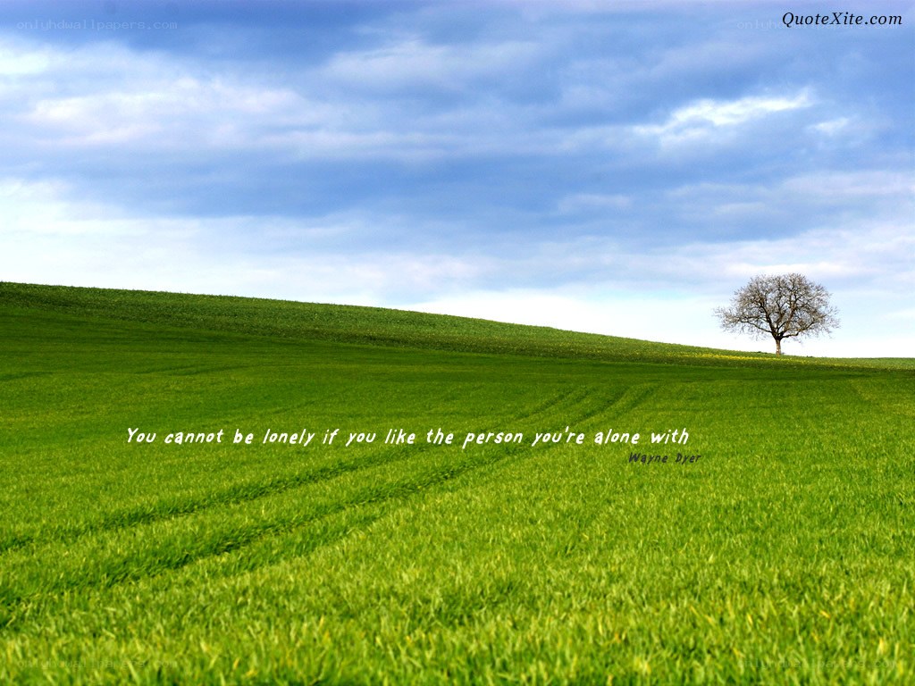 Lone tree in green field