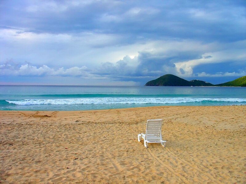 lonely beach chair by the sea