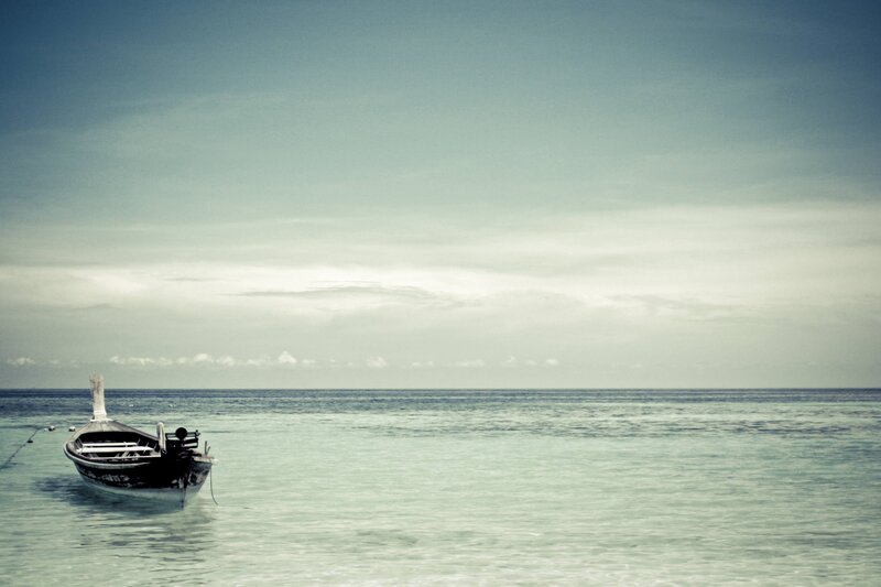 lonely boat on calm sea