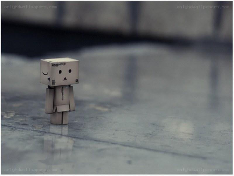 lonely cardboard robot figure