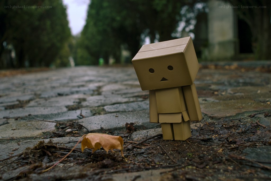 lonely cardboard robot figure