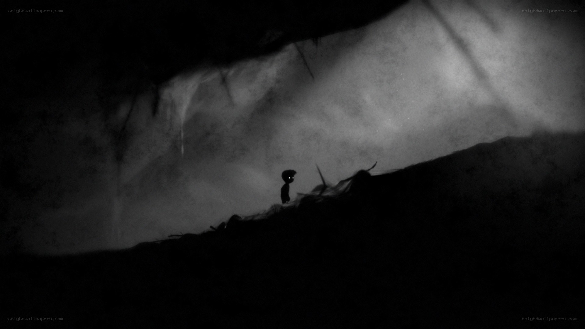 lonely figure in dark cave