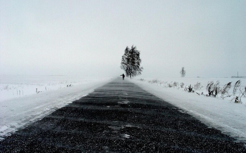 lonely figure on snowy road