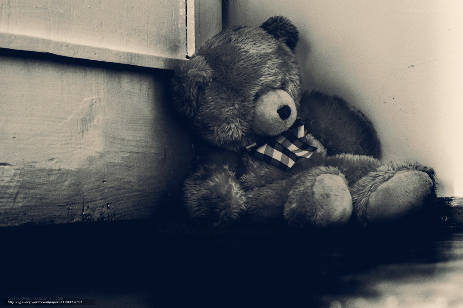 lonely teddy bear in corner