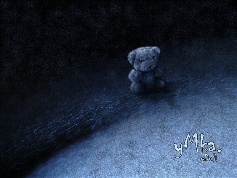 lonely teddy bear in darkness