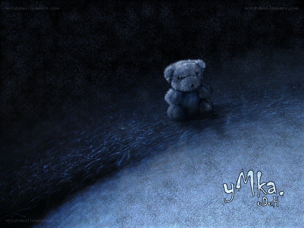 lonely teddy bear in darkness