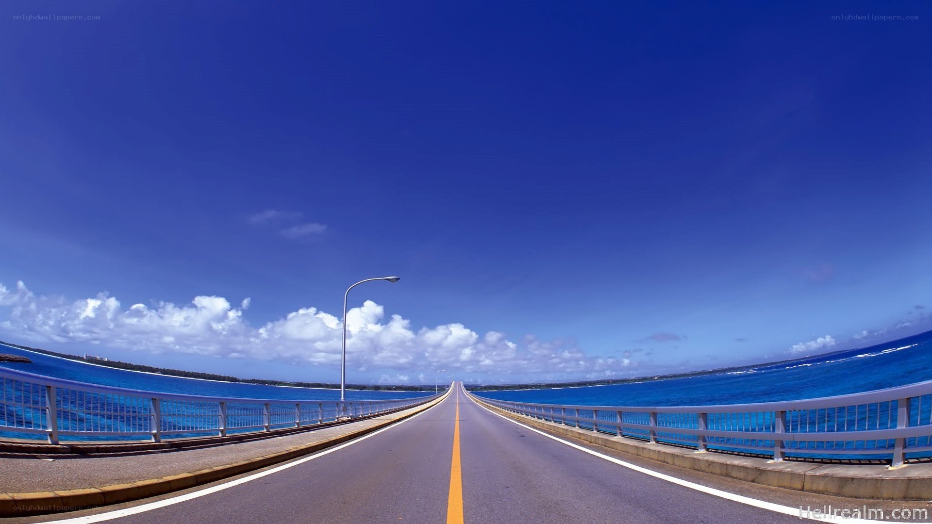Long bridge over blue ocean