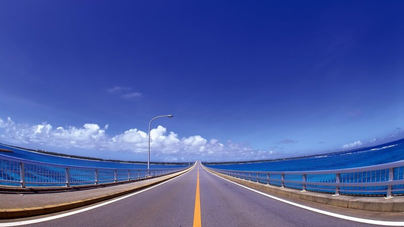 Long bridge over blue ocean