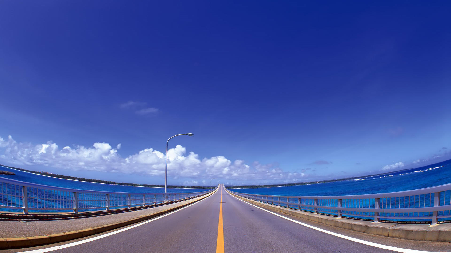 Long bridge over blue ocean