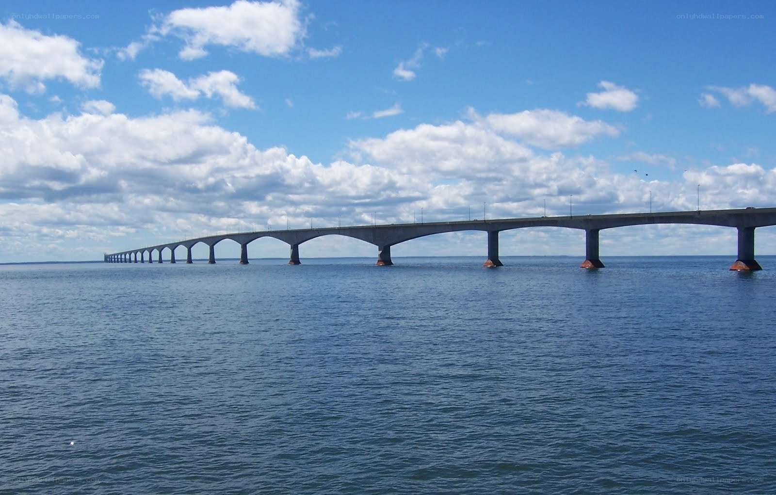 long bridge over blue water