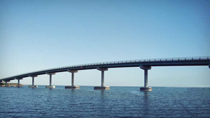 long bridge over blue water