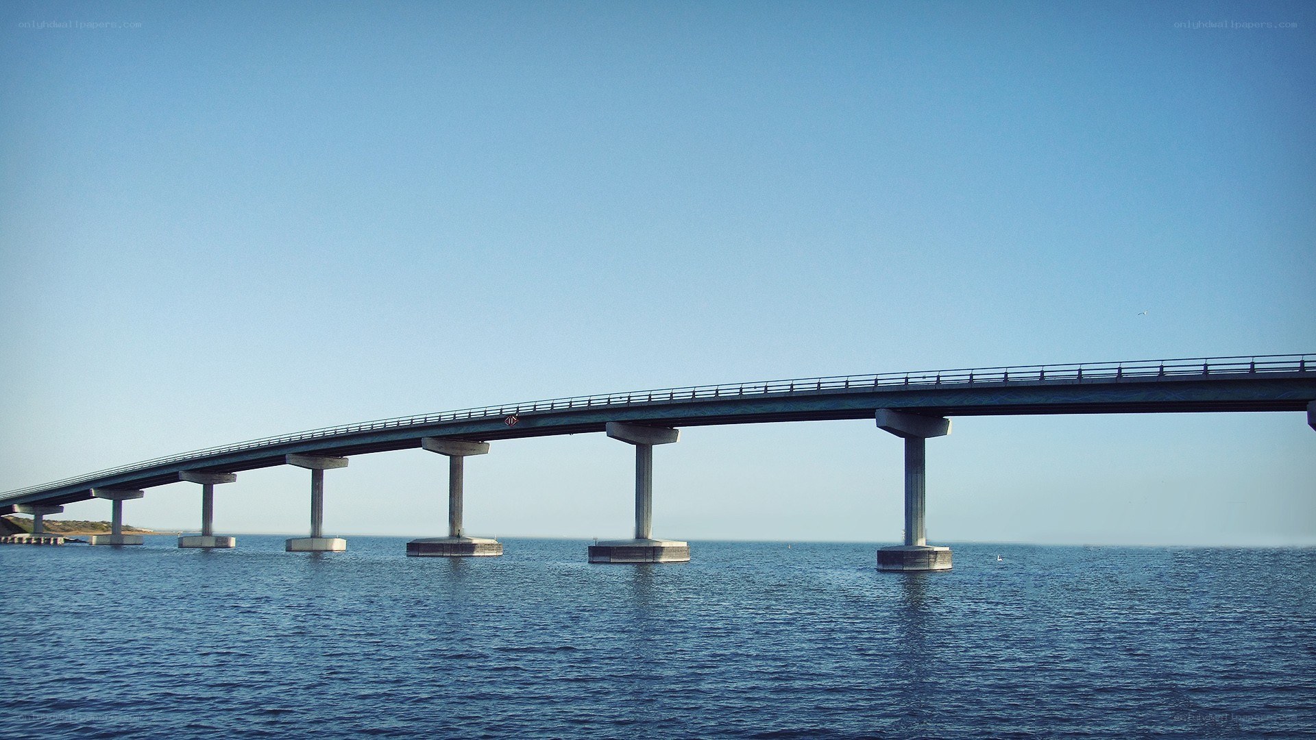 long bridge over blue water