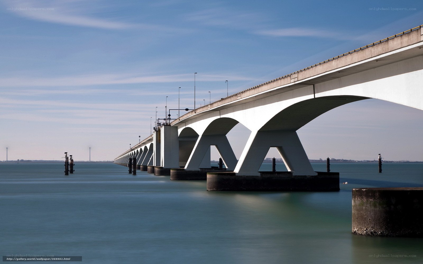 Long bridge over calm water