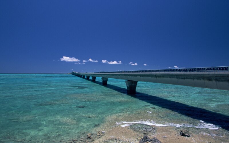Long Bridge over Ocean — Blue, Serene, Afternoon, Photograph, Sky, Clouds, Green
