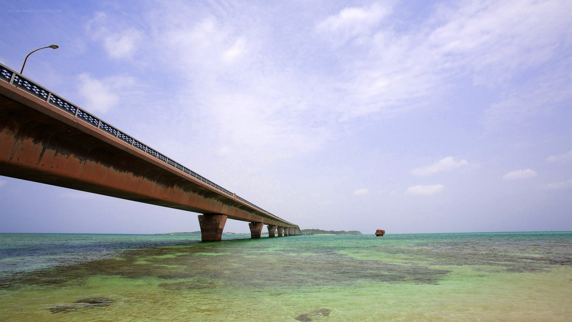 Long bridge over turquoise water