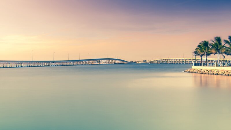 Long Bridge over Water — Blue, Serene, Sunset