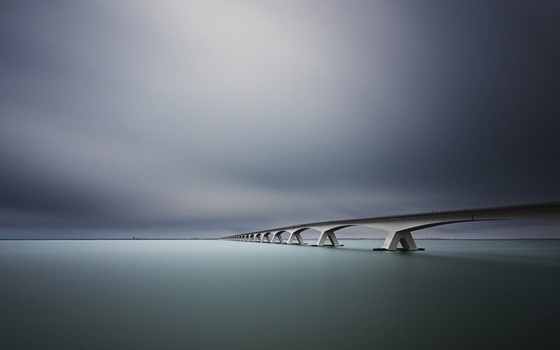 Long Bridge over Water — Gray, Dramatic
