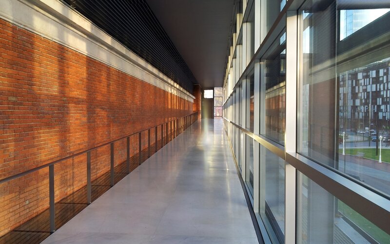 long corridor with brick wall