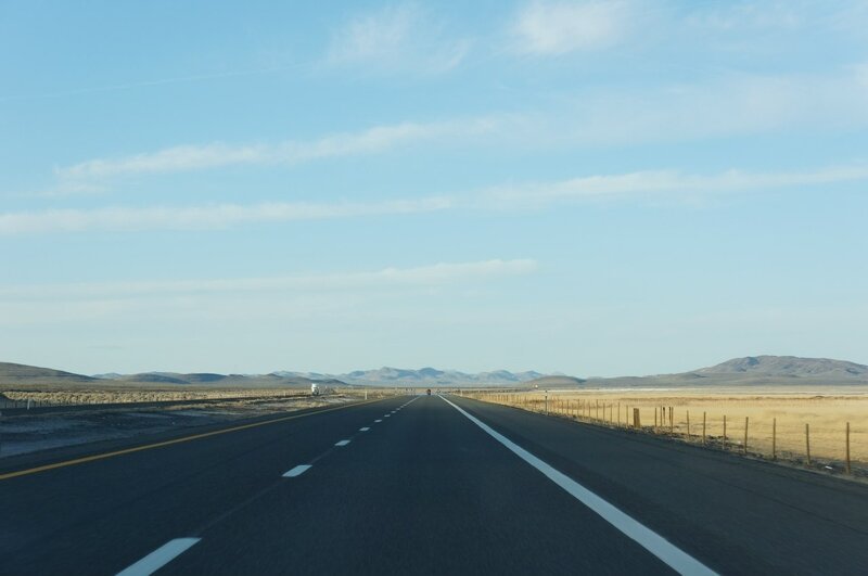Long highway through desert landscape