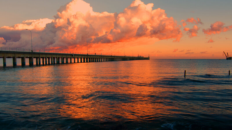 Long Pier at Sunset — Orange, Dramatic, Photograph