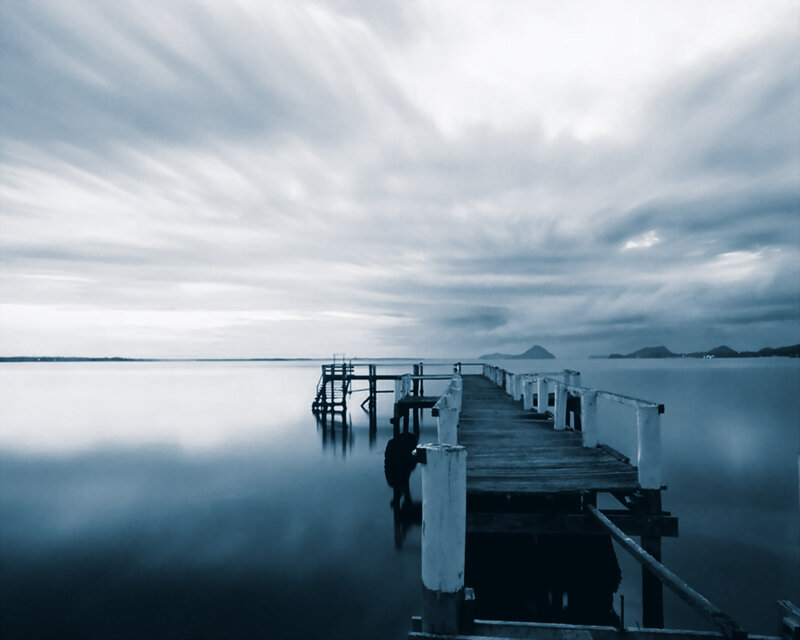 Long pier over calm water