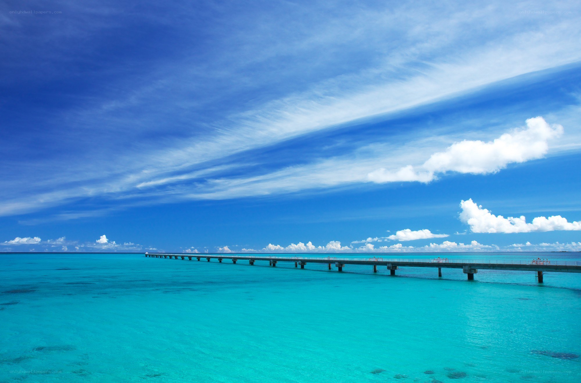 Long pier over turquoise water