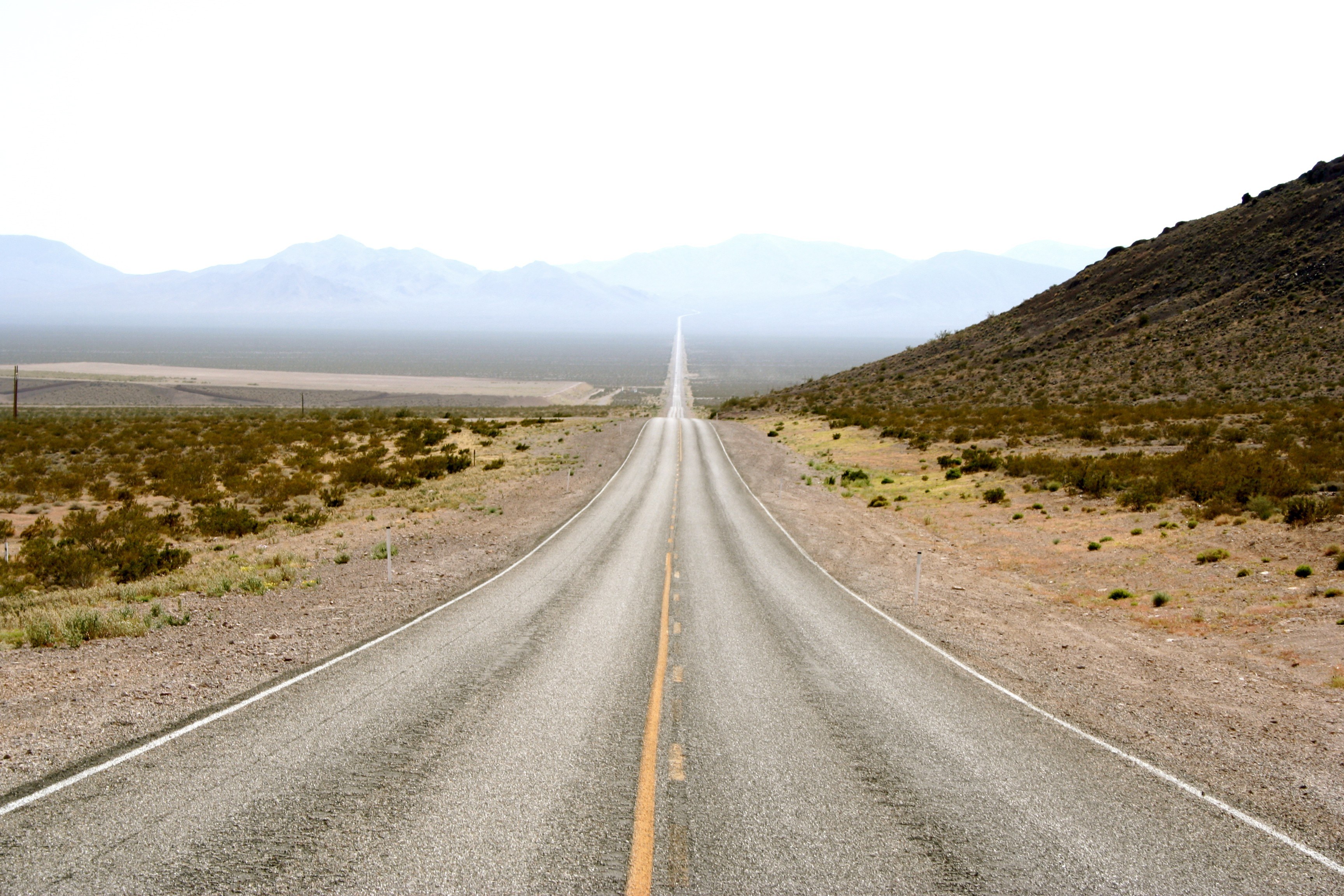 Long road in desert landscape