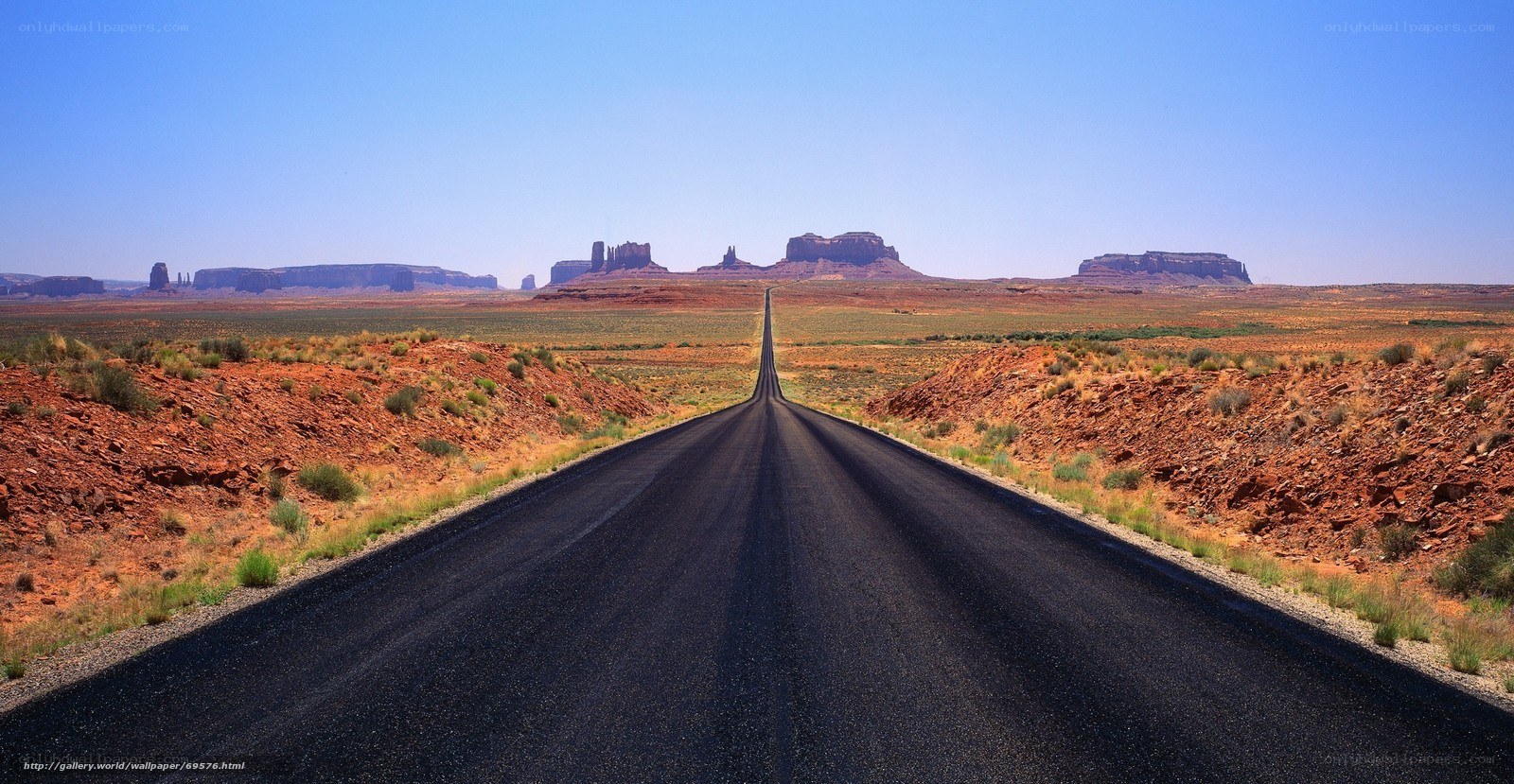 Long road in desert landscape