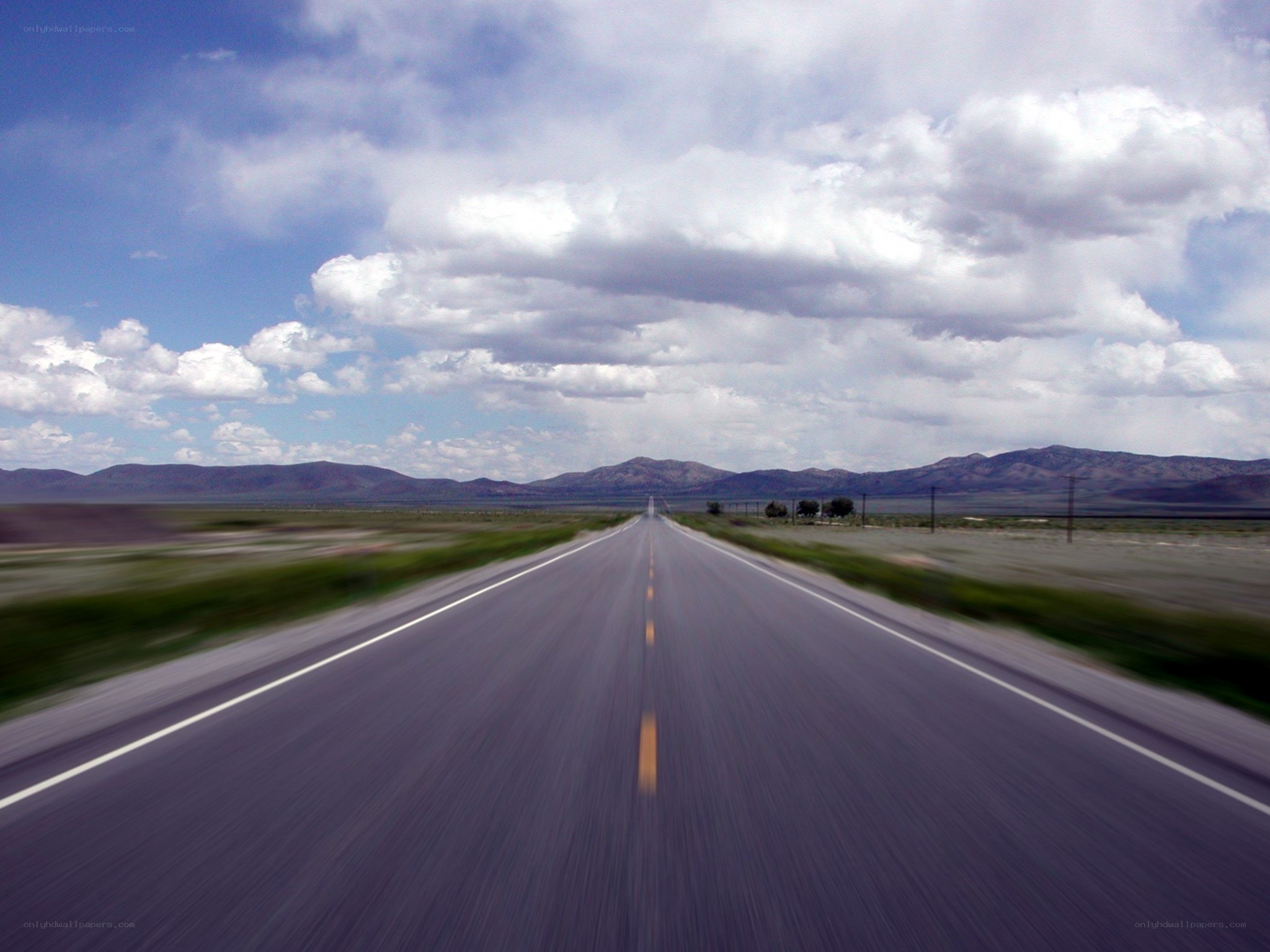 Long road stretching to mountains