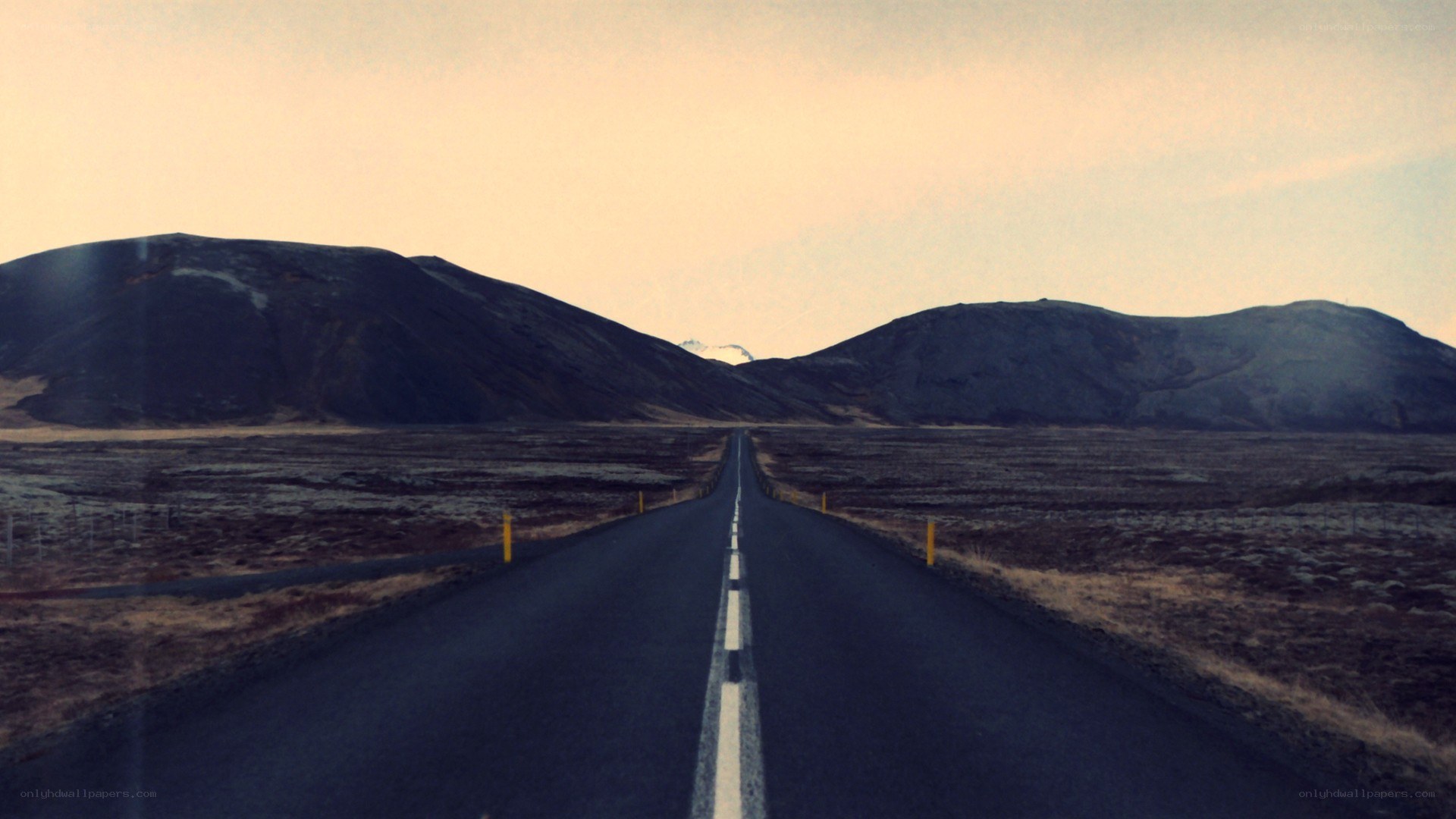 Long road through a barren landscape