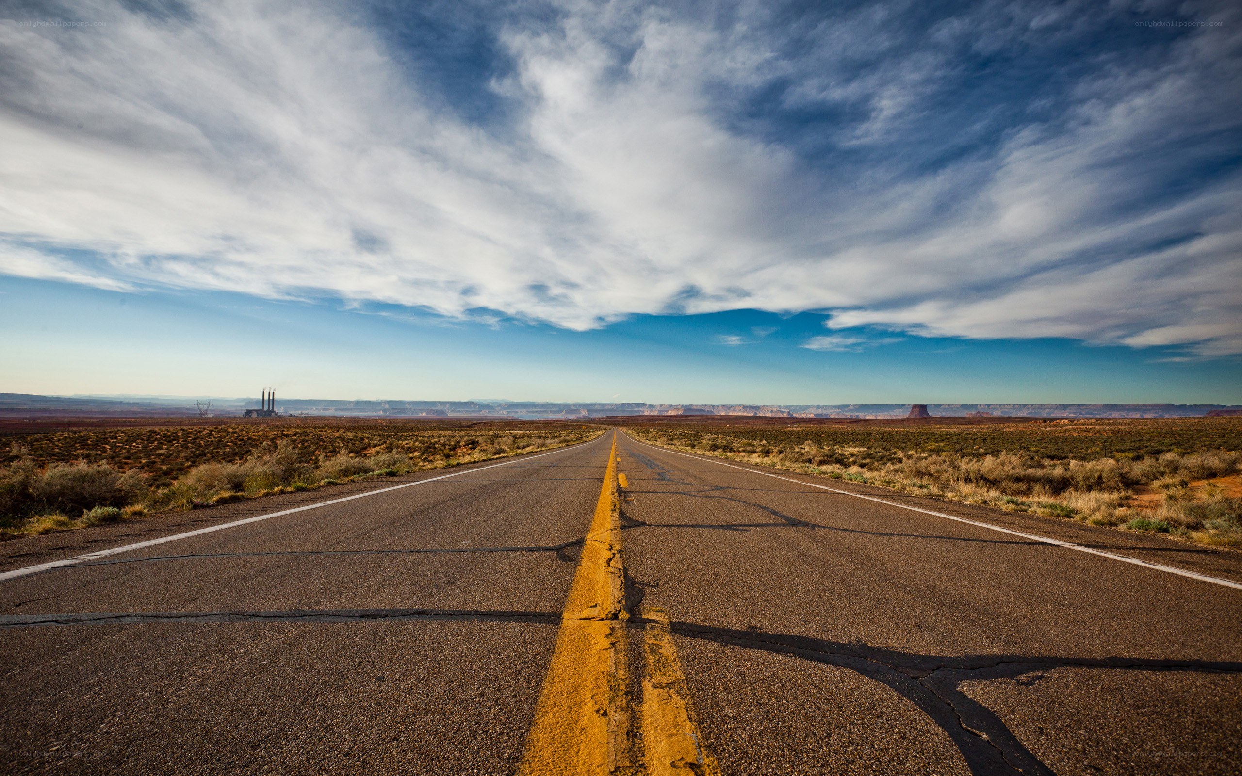 Long road through desert landscape