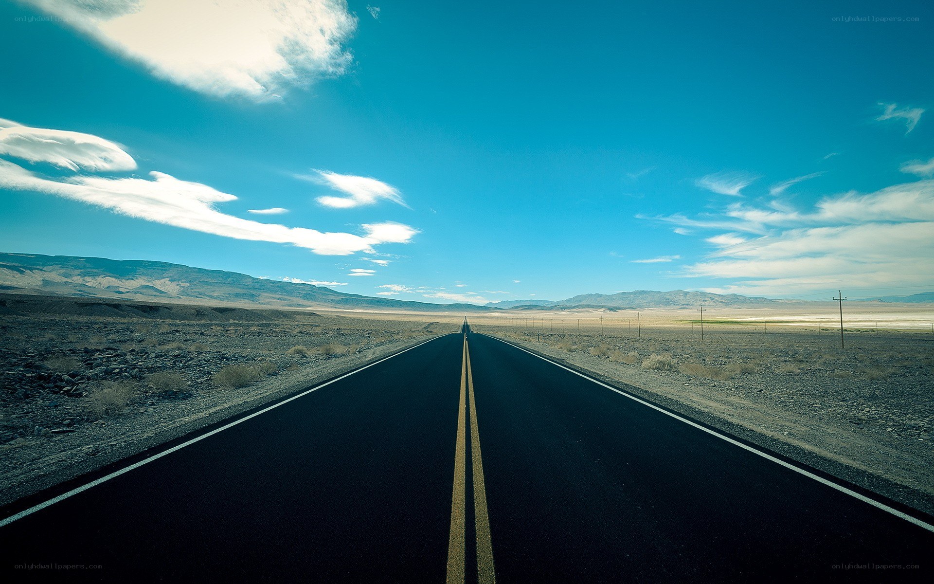Long road through desert landscape