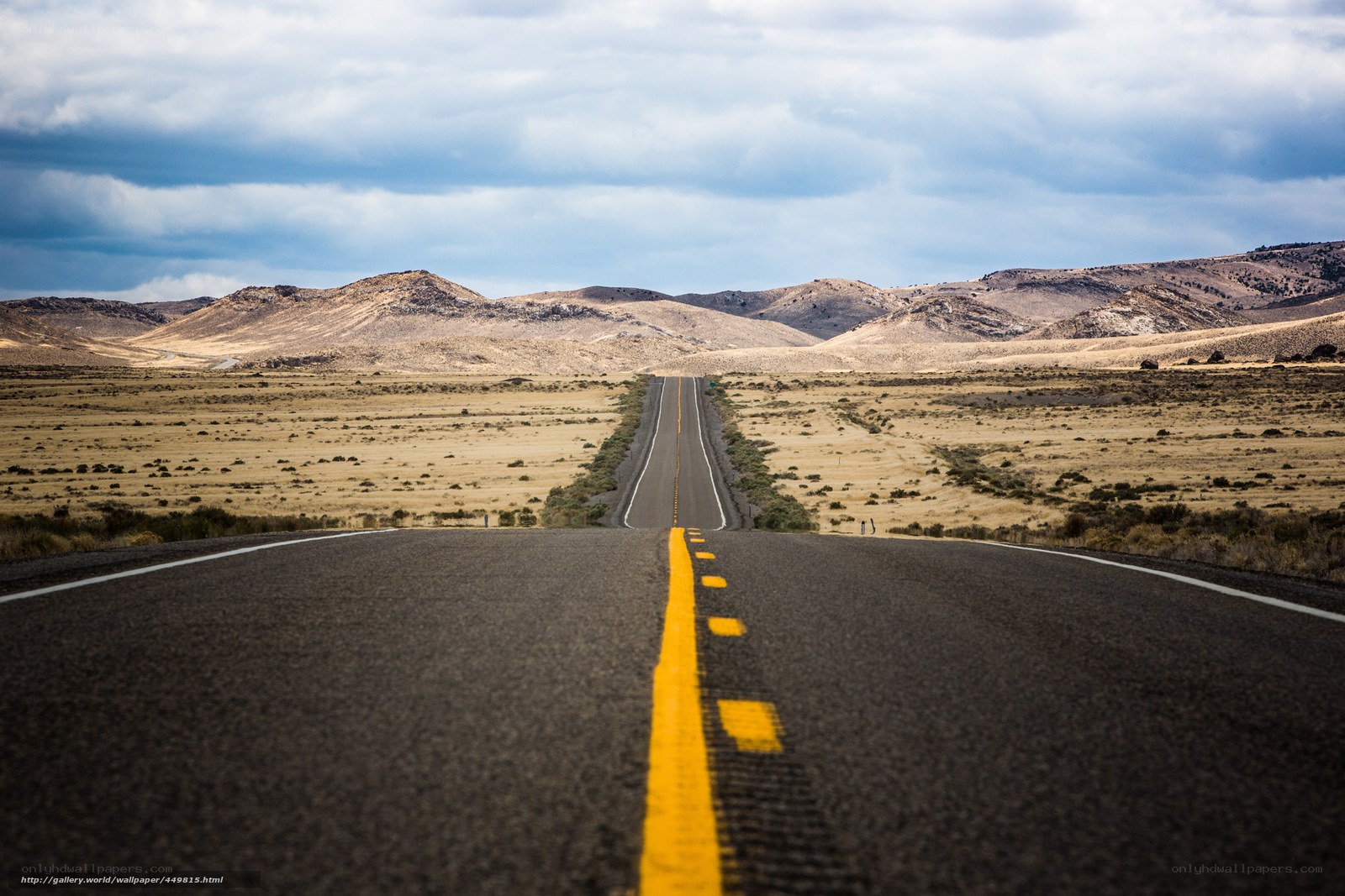 Long road through desert landscape
