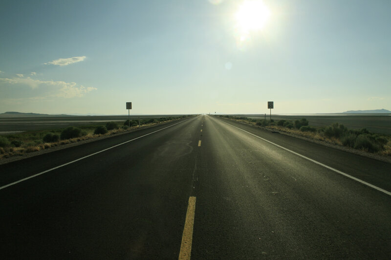 Long road through desert landscape