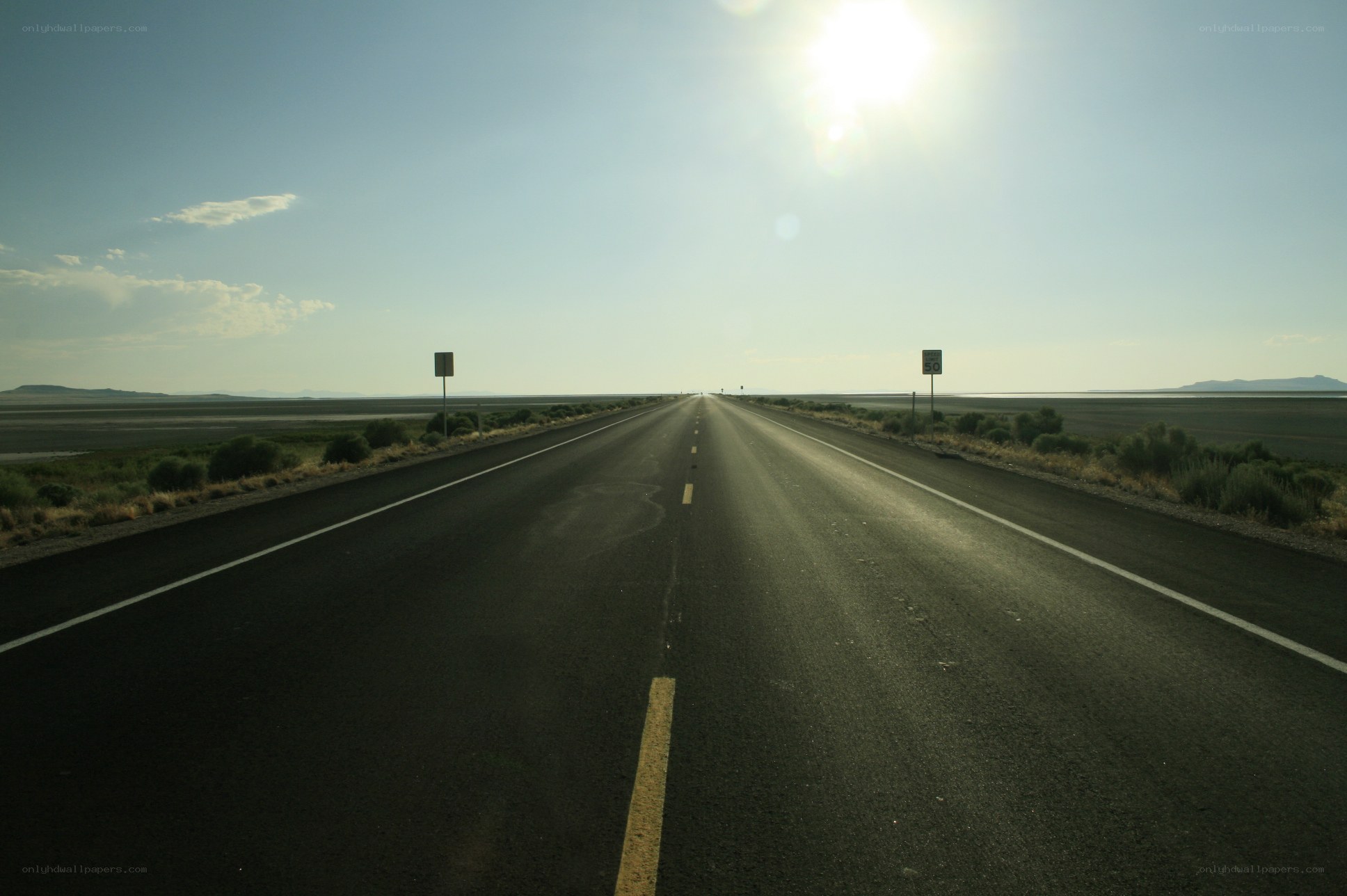 Long road through desert landscape