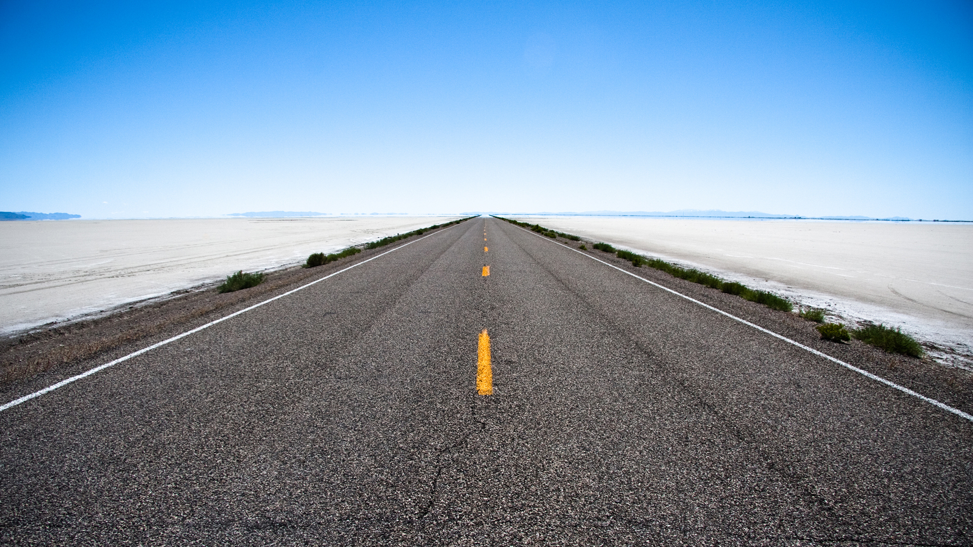 Long road through desert landscape