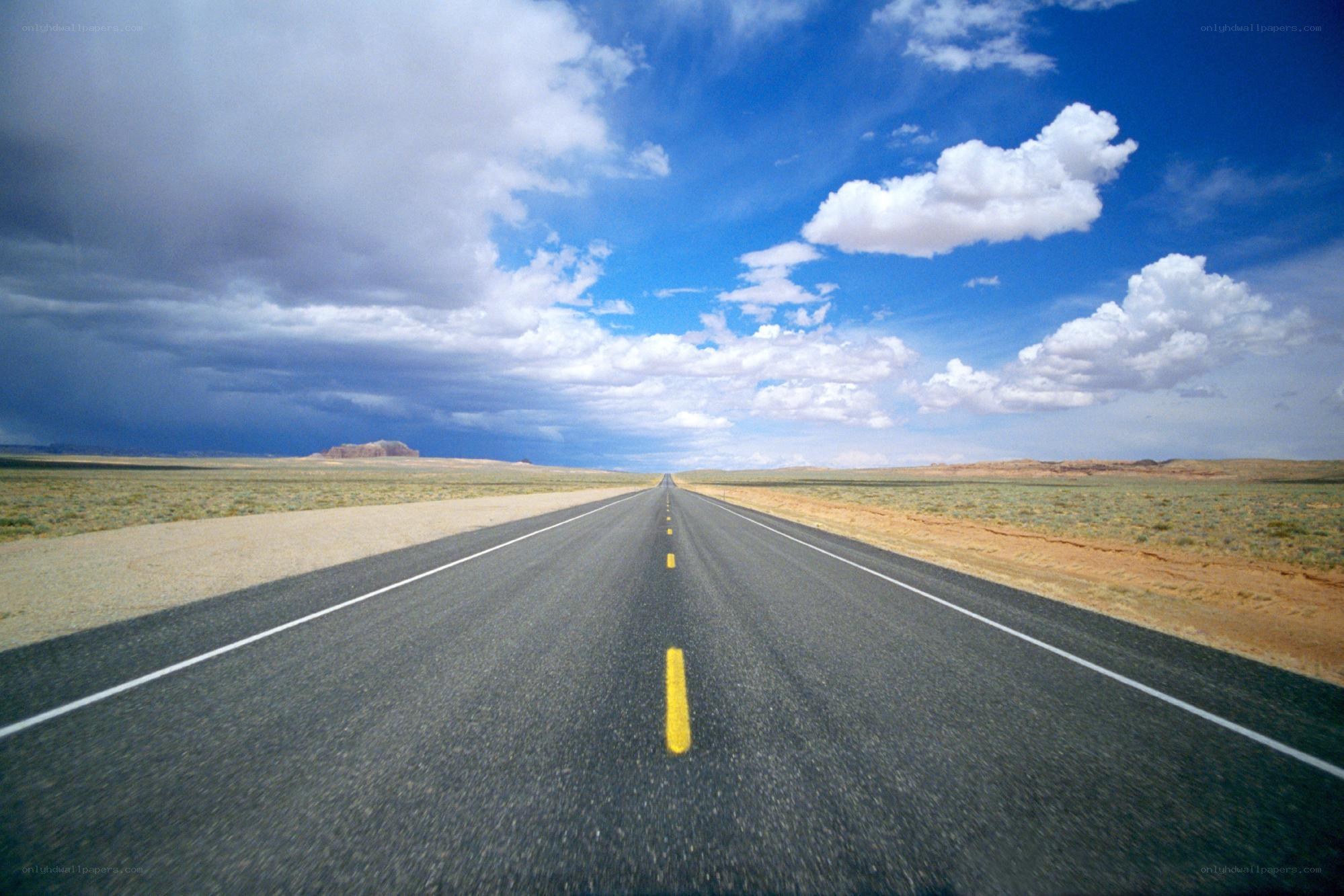 Long road through desert landscape