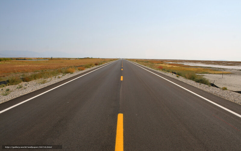 Long road through flat landscape