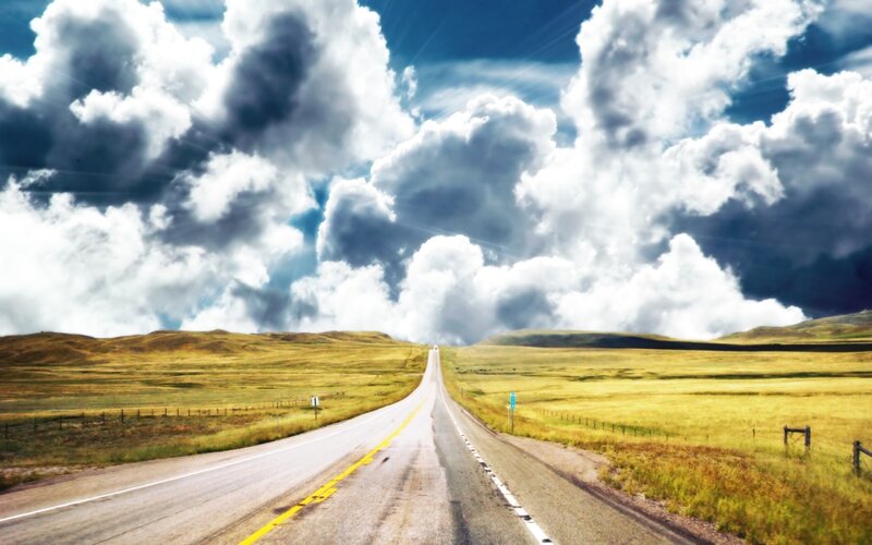 Long road through open fields
