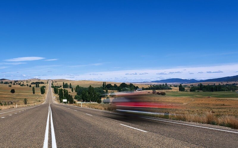 Long road through rural landscape