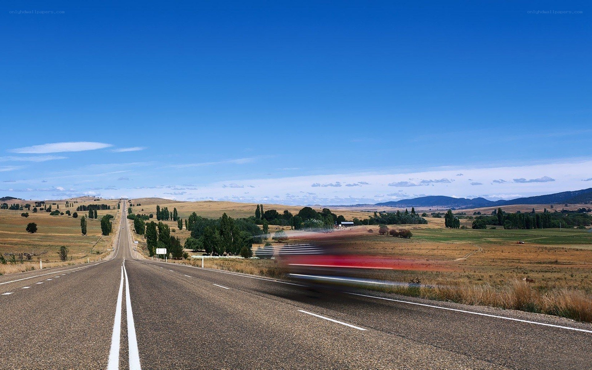 Long road through rural landscape