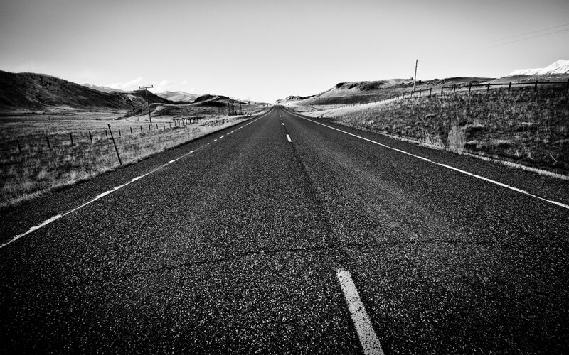 Long road through rural landscape