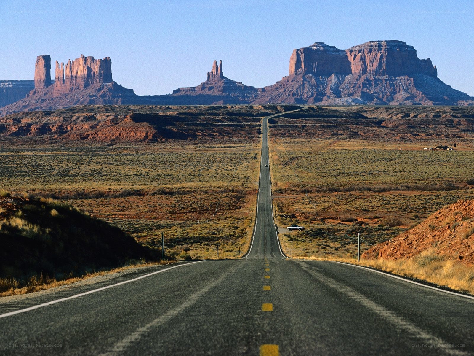 Long road to red rock formations
