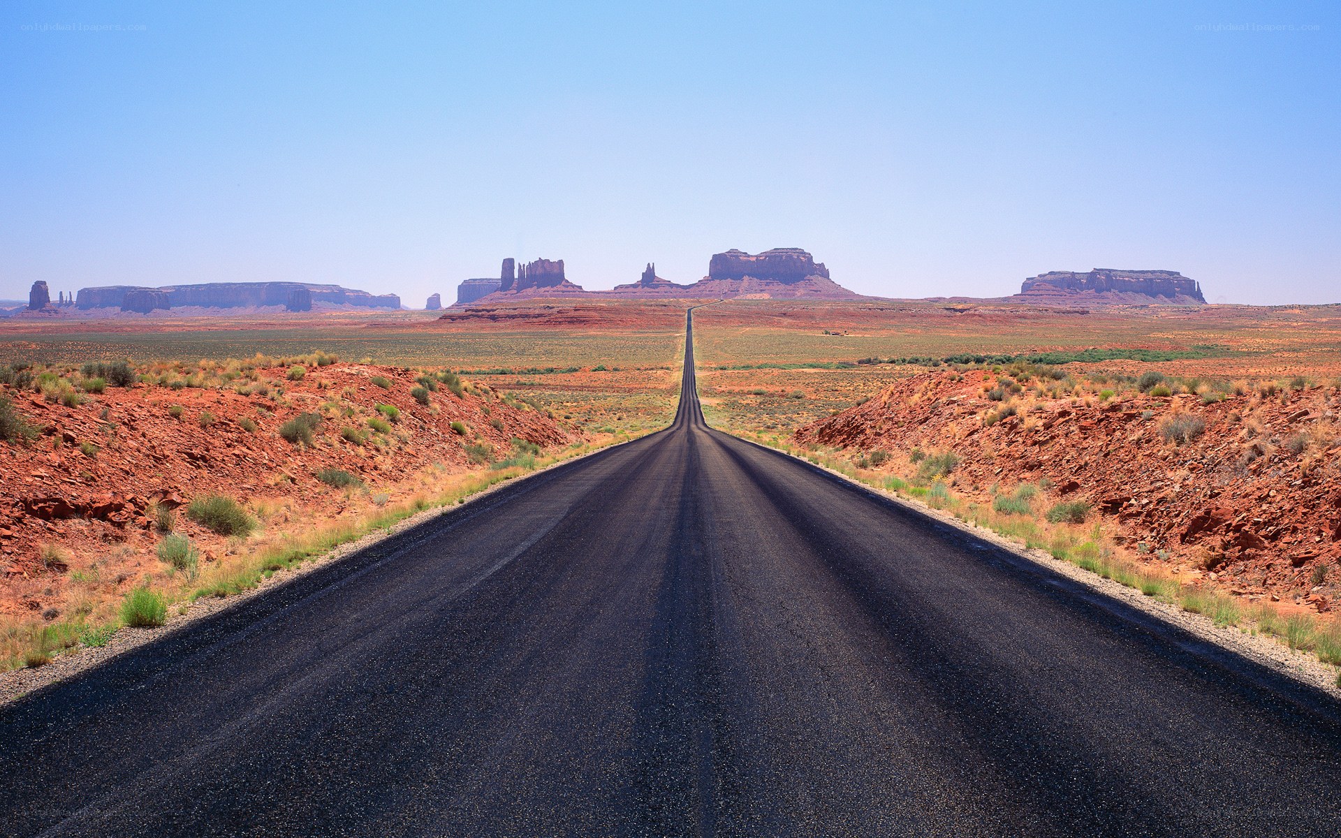 Long road to red rock formations