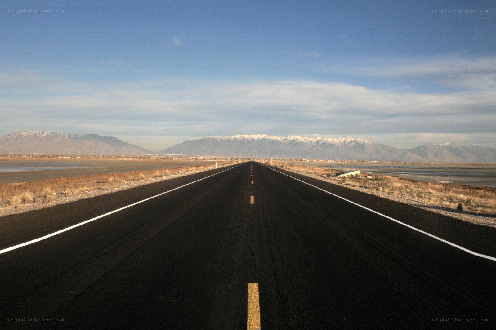 Long road to snow-capped mountains
